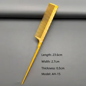 Macro detail of yellow styling comb with non-slip handle and precise scale markings