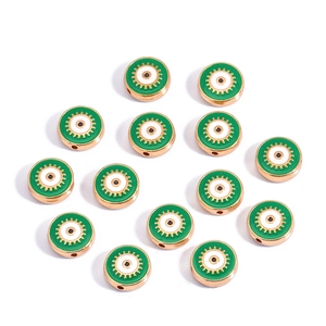 Macro detail of 10mm double-sided green devil eye charms with golden gear-edge beads