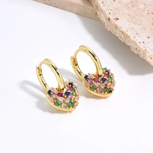 Gold heart hoop earrings with multi-color zircon stones on minimalist white background