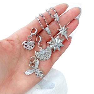 Octagonal star and heart pendant necklace set with cubic zirconia stones in silver finish