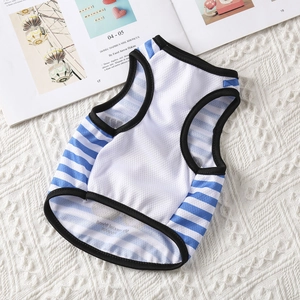 Detail of breathable white mesh pet vest with blue stripes on a soft textured blanket