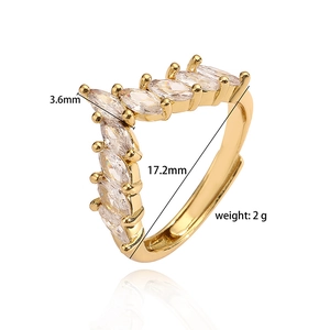 Detail view of adjustable gold ring with marquise-cut cubic zirconia in a V-shaped row