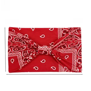 Detail of red paisley wide headband with knot design, size 23x14cm and 27g weight