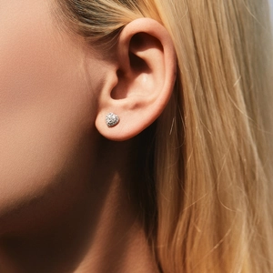 Sparkling S925 sterling silver heart stud earrings with D color moissanite on model