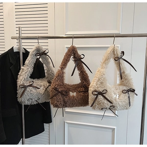 Three plush teddy fleece underarm bags in grey, brown, and beige with bow details