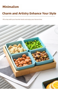 Detail view of four sky blue ceramic snack bowls with a rectangular bamboo serving tray