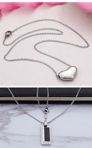 Detail of silver stainless steel necklaces with heart and engraved rectangular pendants