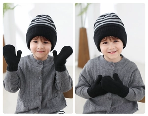 Kids knitted striped beanie and mittens set showing texture and fit on a young child