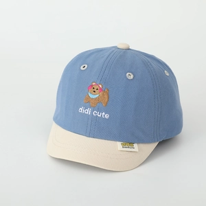 Close-up of bear embroidery and contrast stitching on a toddler cotton baseball cap