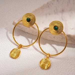 Detail of 24K gold-plated hoop earrings with green malachite stone and woven texture