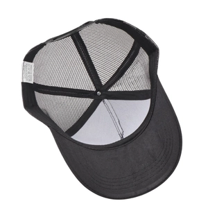 Detail view of the breathable mesh interior and stitching of a black trucker hat