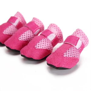 Detail of pink breathable mesh dog shoes with adjustable straps and non-slip soles