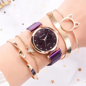 Detailed view of a purple quartz watch set with four gold decorative bracelets for women
