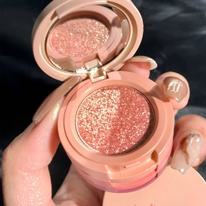 Three-color glitter eyeshadow palette with mirror in a rose gold round compact case