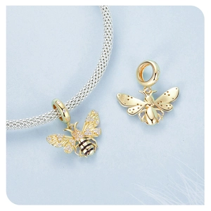Detail of S925 sterling silver honey bee charm with gold plating and clear zircon inlay