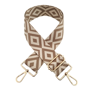 Detail of 5cm geometric rhombus woven bag strap with polished gold metal hardware