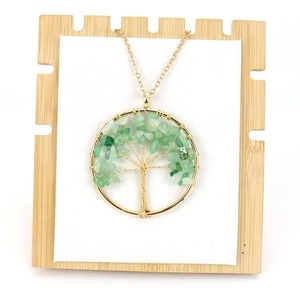 Handmade gold wire-wrapped tree of life necklace with green natural crystal stones