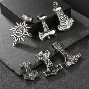 Vintage Viking Thor's Hammer and Celtic sun wheel pendants in silver stainless steel