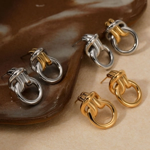 Minimalist interlocking double hoop earrings in polished gold and silver finishes
