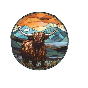 Stained glass style highland cow round hanging decoration with mountain sunset backdrop