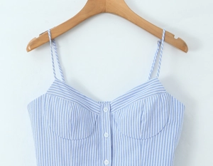 Close-up of blue and white vertical striped camisole top with front button detailing