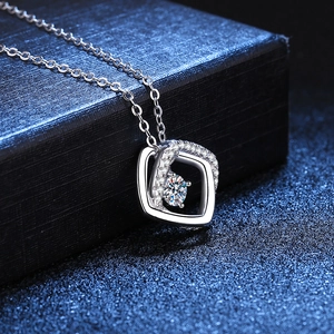 Moissanite S925 sterling silver necklace with geometric square pendant on a jewelry box