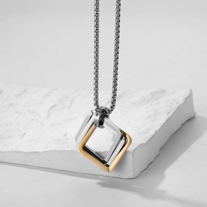 Minimalist geometric square pendant necklace in silver and gold dual-tone steel