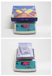 Weight measurement of magnetic Klotski sliding puzzle toys shown on a digital scale