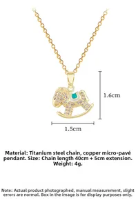Detail of gold rocking horse pendant with rhinestones measuring 1.5cm by 1.6cm on chain