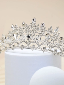 Detailed view of silver bridal crown with sparkling rhinestones and crystal flower motifs