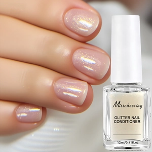 Detailed view of pink glitter nail conditioner oil in a 12ml bottle with brush
