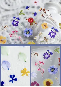 Macro detail of ultra-thin crystal clear floral nail stickers with high-definition patterns