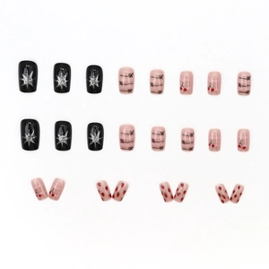 24-piece press-on nail set with glitter, bow, cherry, and strawberry designs in pink and black