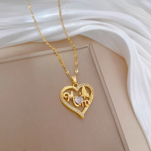 Elegant gold titanium necklace with hollow heart, butterfly and MOM pendant on white silk