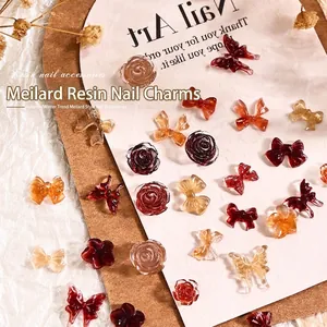 Maillard brown resin nail charms set with butterfly and camellia shapes for autumn