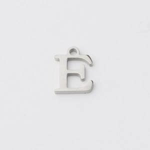 Macro view of a mirror-polished stainless steel letter E pendant with hanging loop