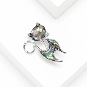 Elegant cat brooch featuring natural abalone shell and sparkling crystals in silver tone
