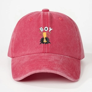 Detail of washed cotton baseball cap featuring embroidered BOY text and trophy graphic