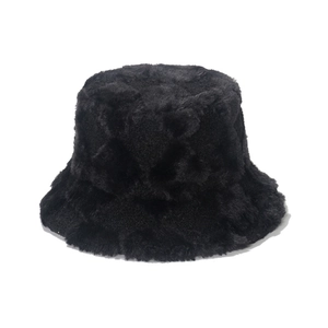 Plush faux fur bucket hat in solid black with warm geometric fleece texture for winter
