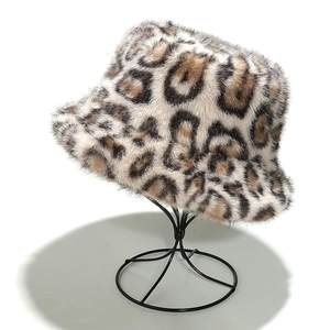 Detail view of leopard print faux fur bucket hat showing plush texture on a display stand