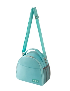 Detail view of mint green insulated lunch bag with adjustable shoulder strap and side mesh pocket
