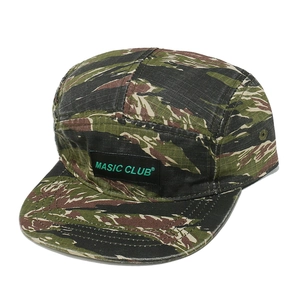 Detailed shot of the tiger stripe camo pattern on a five-panel flat brim camper hat