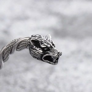 Macro shot of Viking wolf head bracelet with intricate twisted steel wire texture