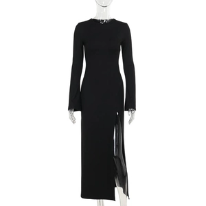 Detail of slim fit black long sleeve maxi dress featuring a high side split design