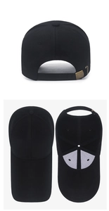 Detail view of black baseball cap showing the adjustable metal buckle and inner lining