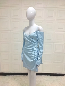 Detailed view of light blue satin off-shoulder dress with long sleeves and pleated waist