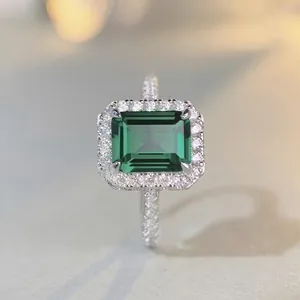 S925 sterling silver ring featuring a 3-carat emerald-cut green gemstone with halo diamonds