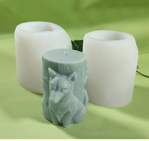 Detail view of 3D wolf relief on cylindrical candle with white silicone DIY mold