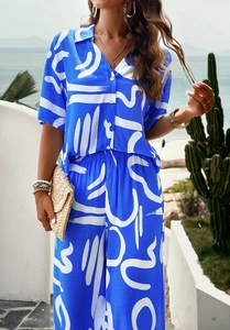 Blue and white floral print casual set featuring a short sleeve shirt and wide leg pants