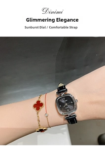 Detail of square silver watch with sunray dial and leather strap worn on wrist